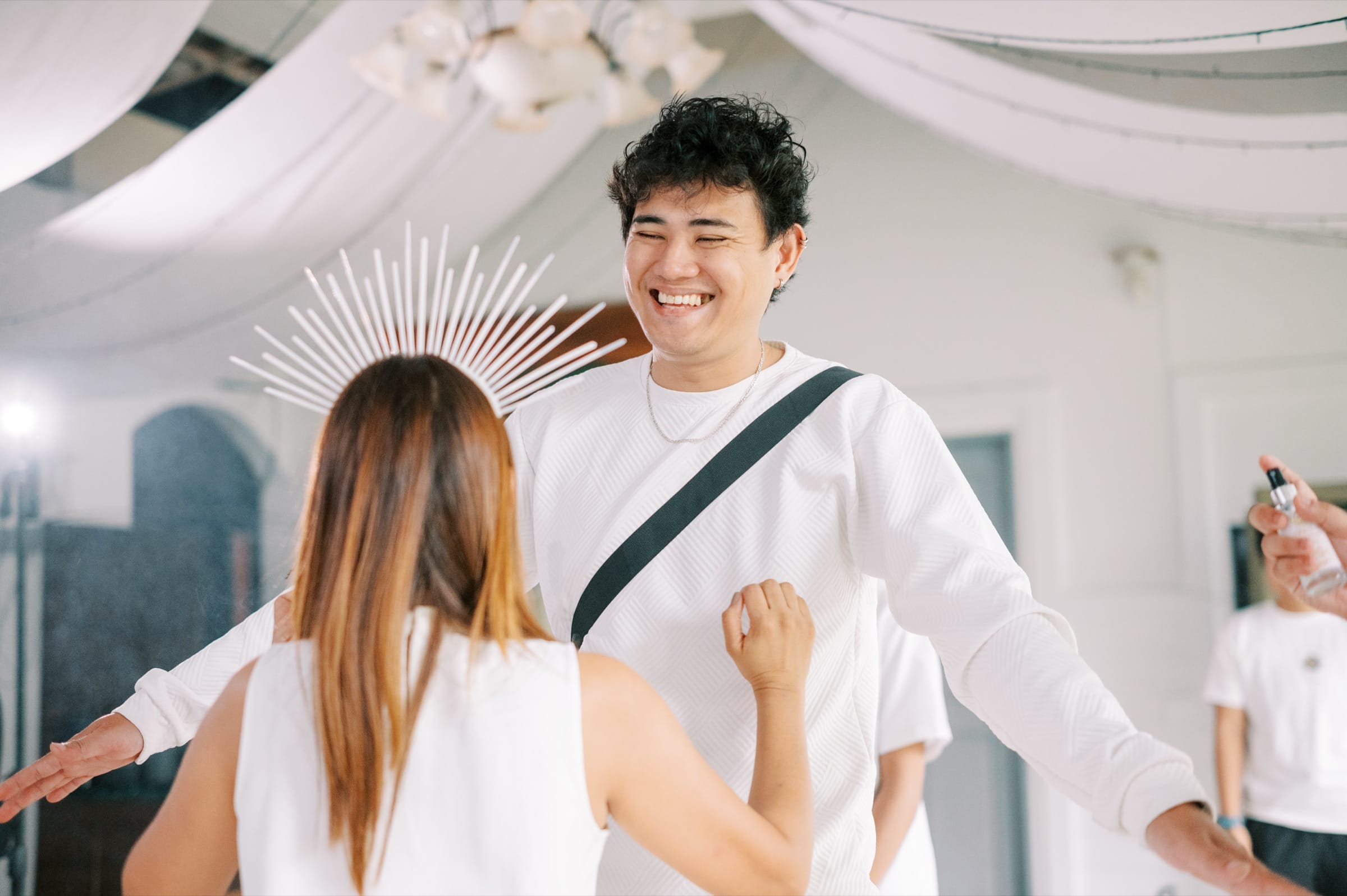 Two participants laughing together during a joyful connection exercise