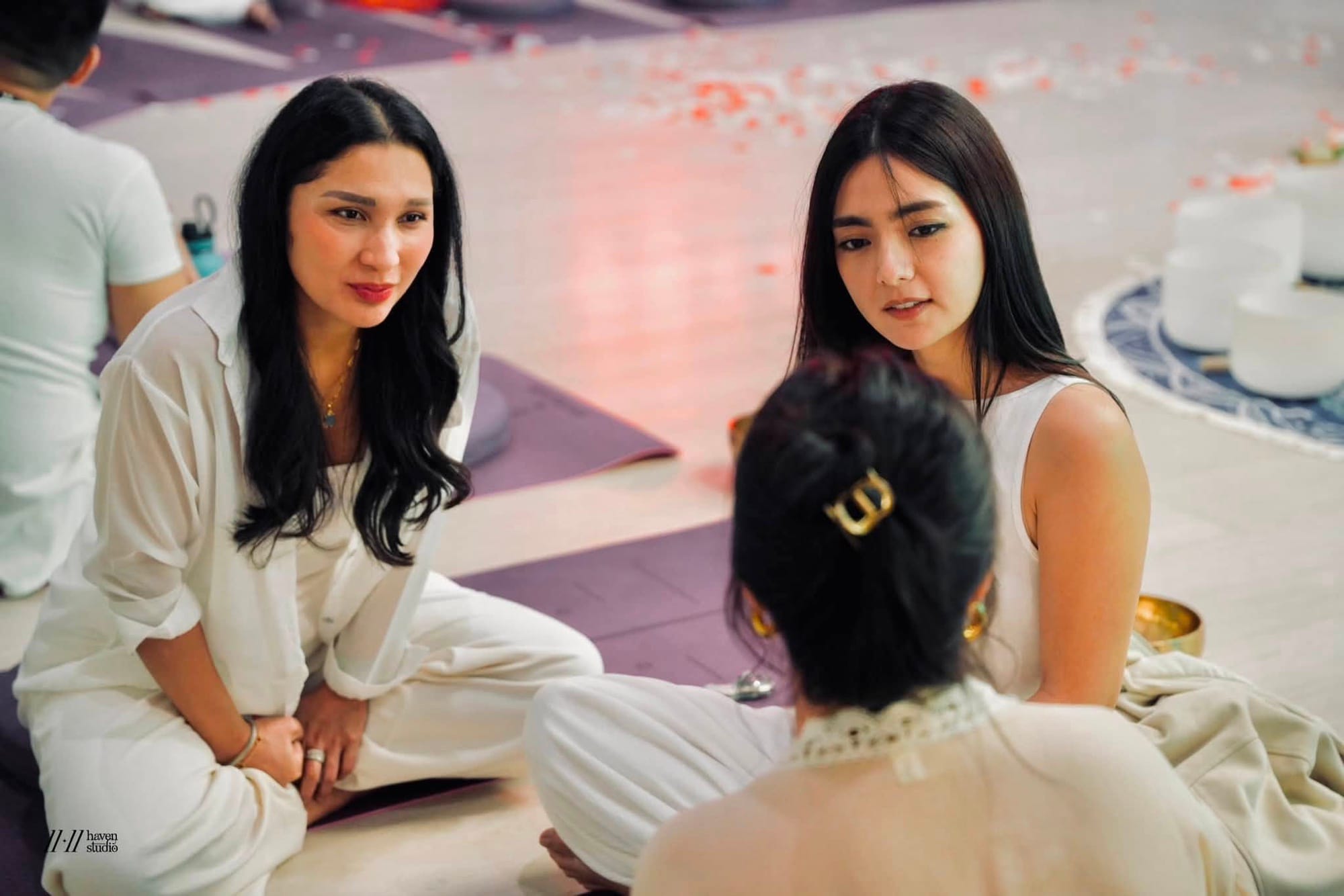 Three participants in an intimate, close conversation during a sharing circle
